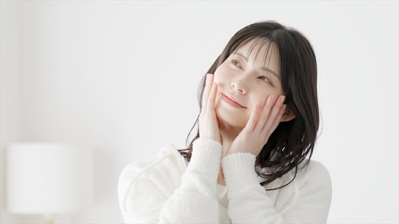A woman doing skin care in the morning