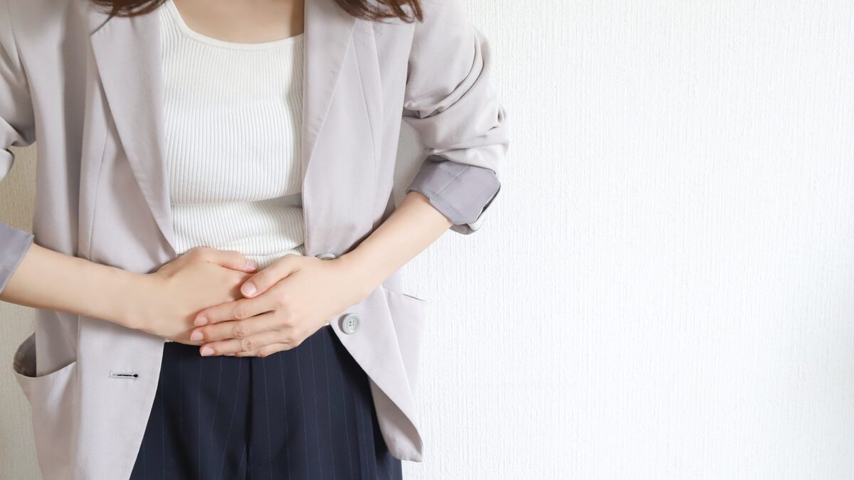 A woman holding her stomach