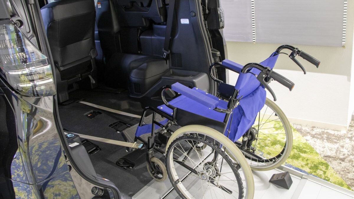 Interior of a wheelchair-accessible vehicle equipped with a ramp. Features an electric winch that automatically pulls the wheelchair into the vehicle.