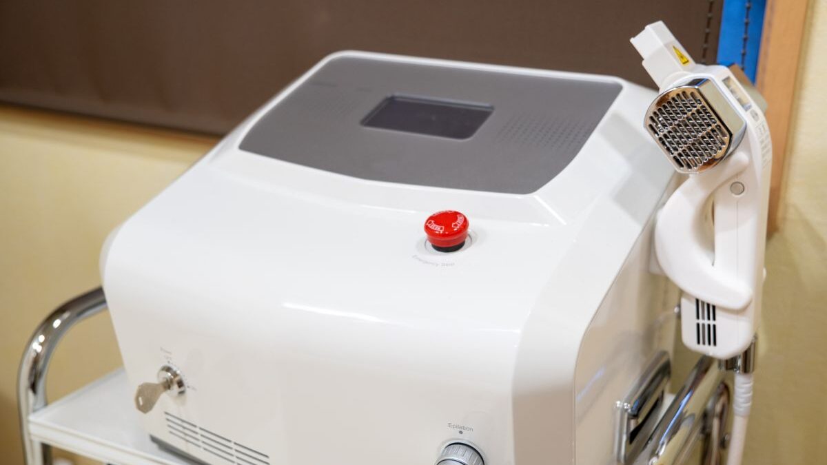 A photo of a professional laser hair removal machine, representing the medical and salon devices used for men’s VIO hair removal.