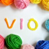 The letters “VIO” made of colorful yarn, symbolizing men’s VIO hair removal.